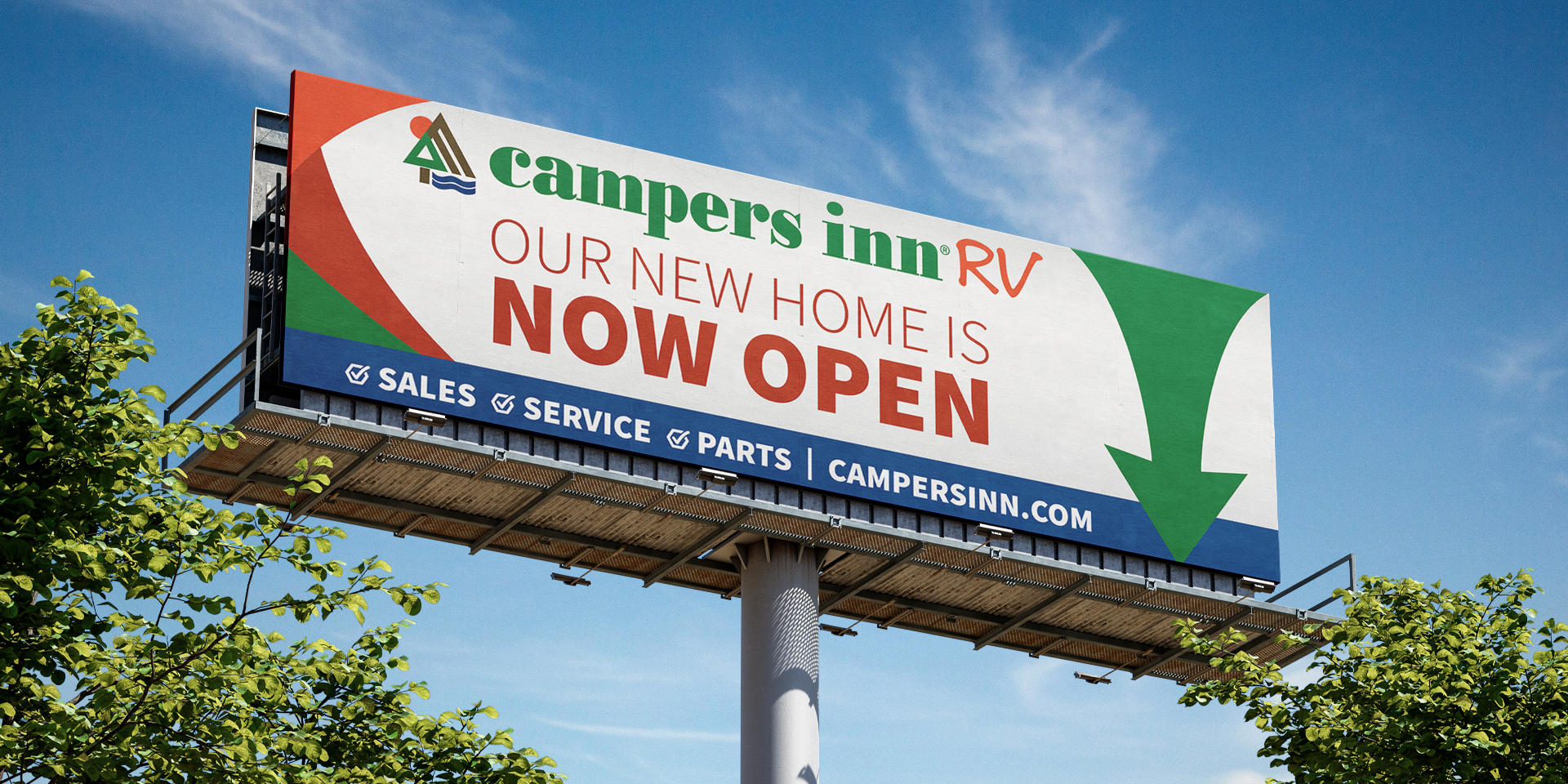 A billboard for Campers Inn RV that states "Our New Home is Now Open"